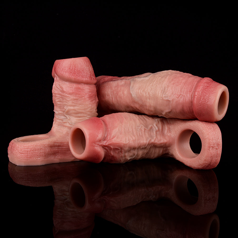 Two realistic extender sleeves with ring openings, pink finish