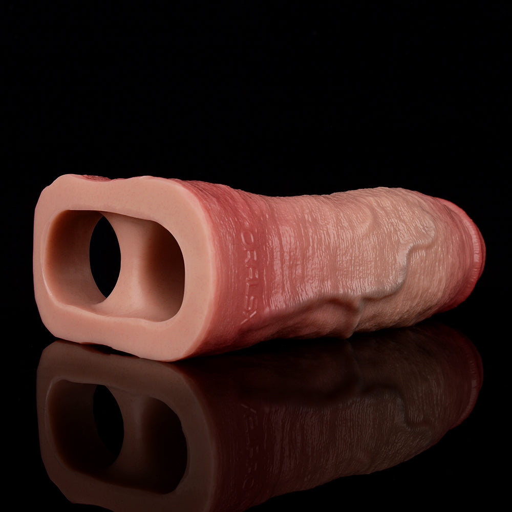 Realistic dick sleeve with ring, open end visible; lifelike textured surface.