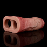 Realistic dick sleeve with ring, open end visible; lifelike textured surface.