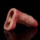 Realistic penis extender sleeve with ring; curved open tip and detailed texture.
