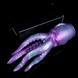 Angled view of purple-and-teal tentacled masturbator with suction nubs and ridges
