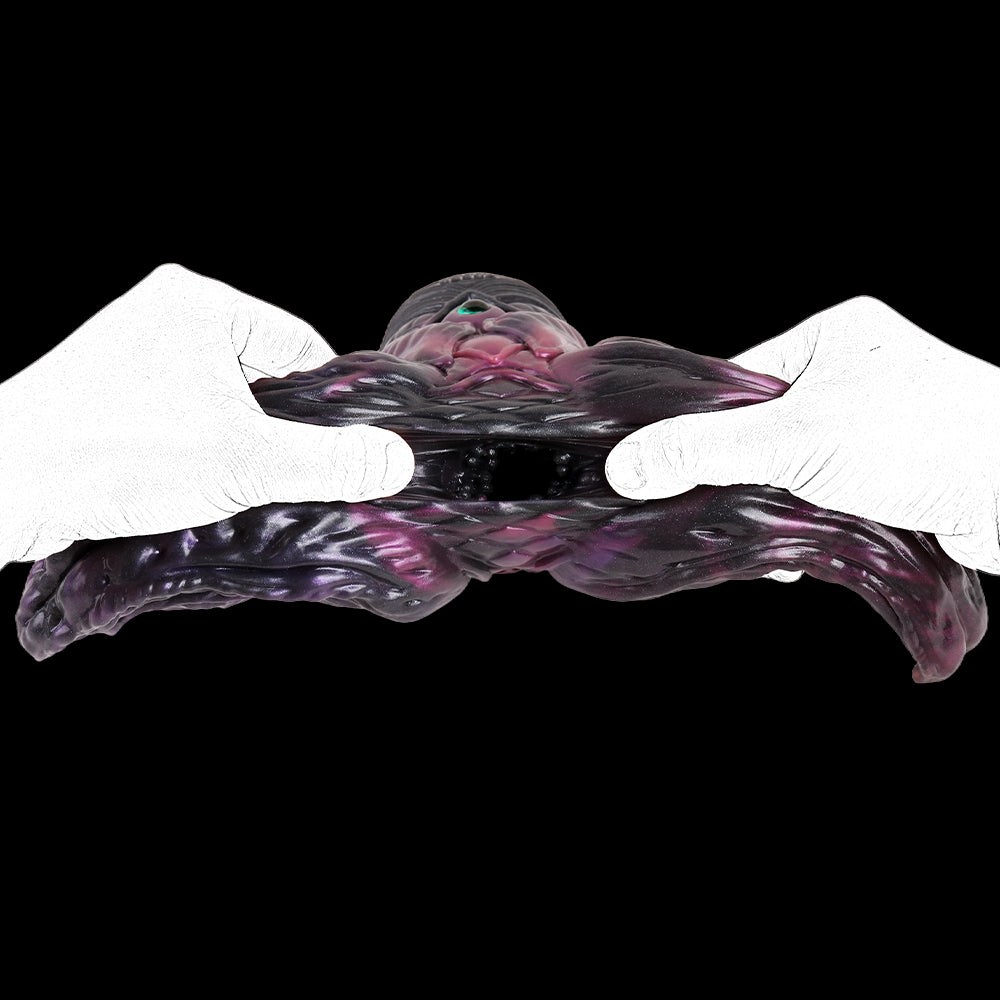 Octopus tentacle toy held by white-gloved hands, purple body and tentacles