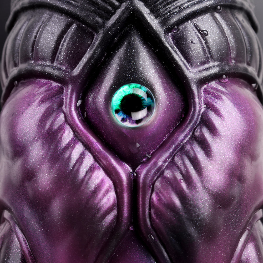 Turquoise eye close-up on purple-black octopus head