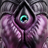 Turquoise eye close-up on purple-black octopus head