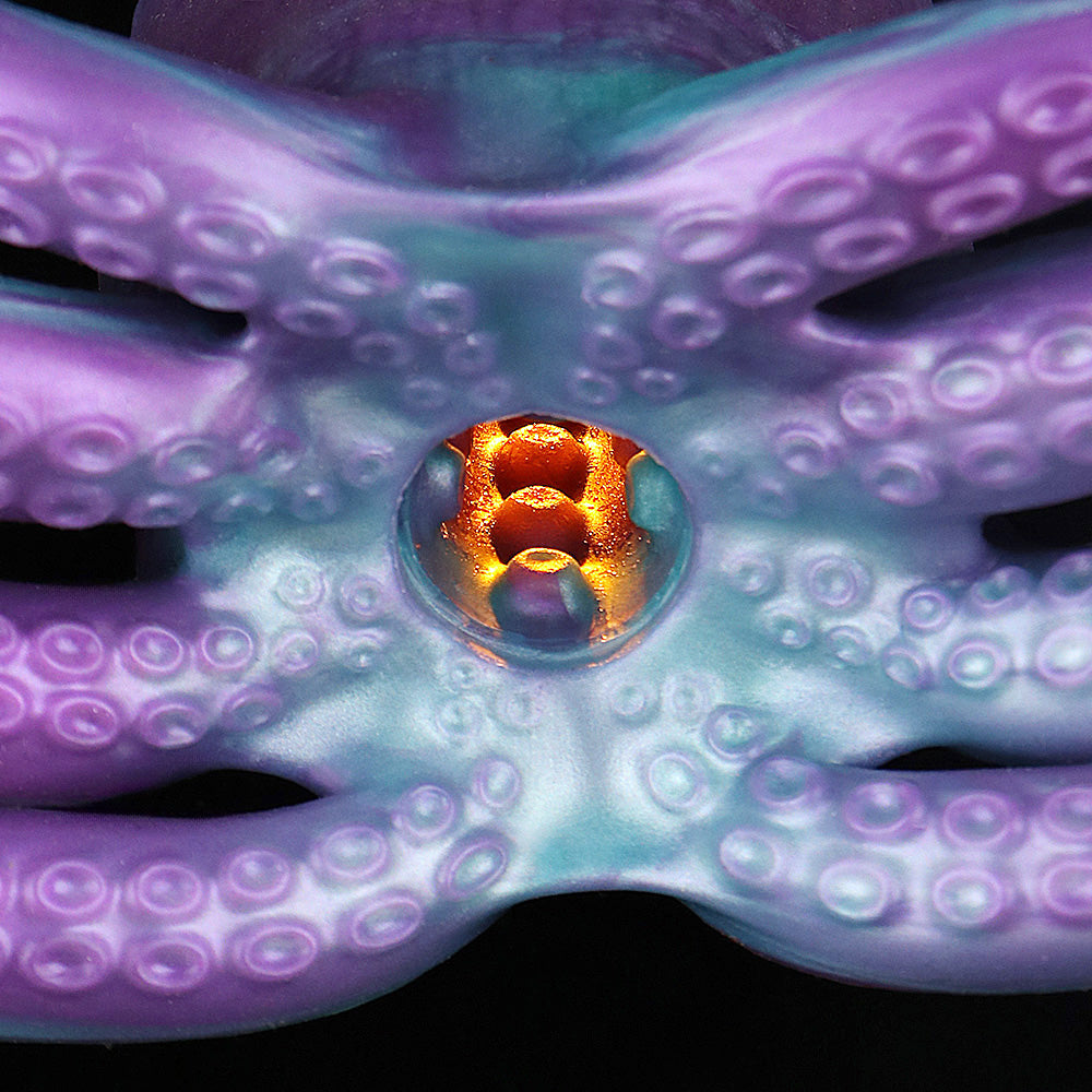 Close-up of octopus masturbator tentacle body with orange-lit inner opening