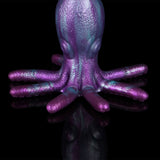 Close front view of purple octopus tentacle masturbator, textured suction-cup arms