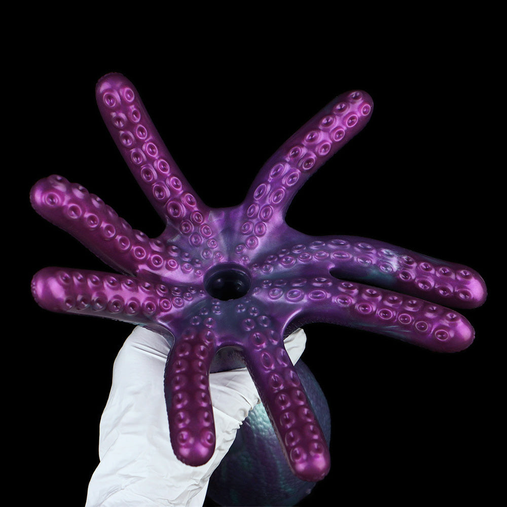 Octopus tentacle masturbator with 8 curved arms and raised suction-cup texture, purple