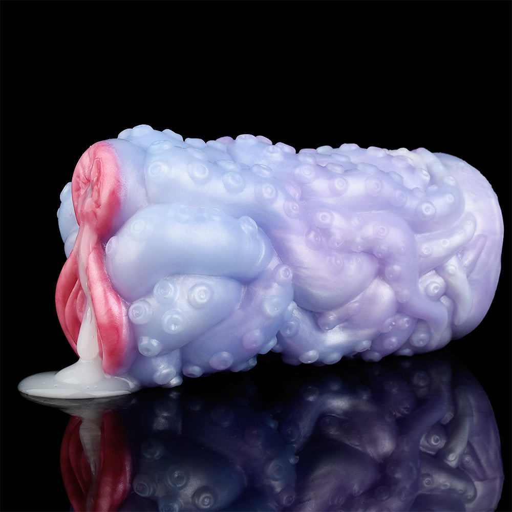 Dual-hole octopus-style vibrator, blue textured surface with pink side accent