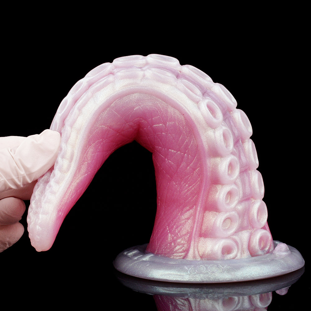 Monster tentacle dildo with open-loop shape; textured suction-cup ribs and thick base