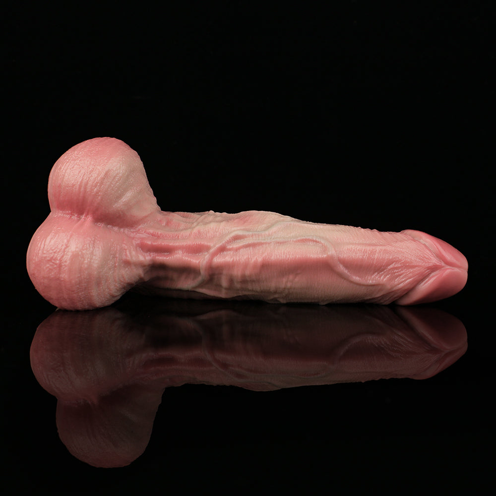 Pink realistic dildo with detailed veining and smooth rounded tip, side view.