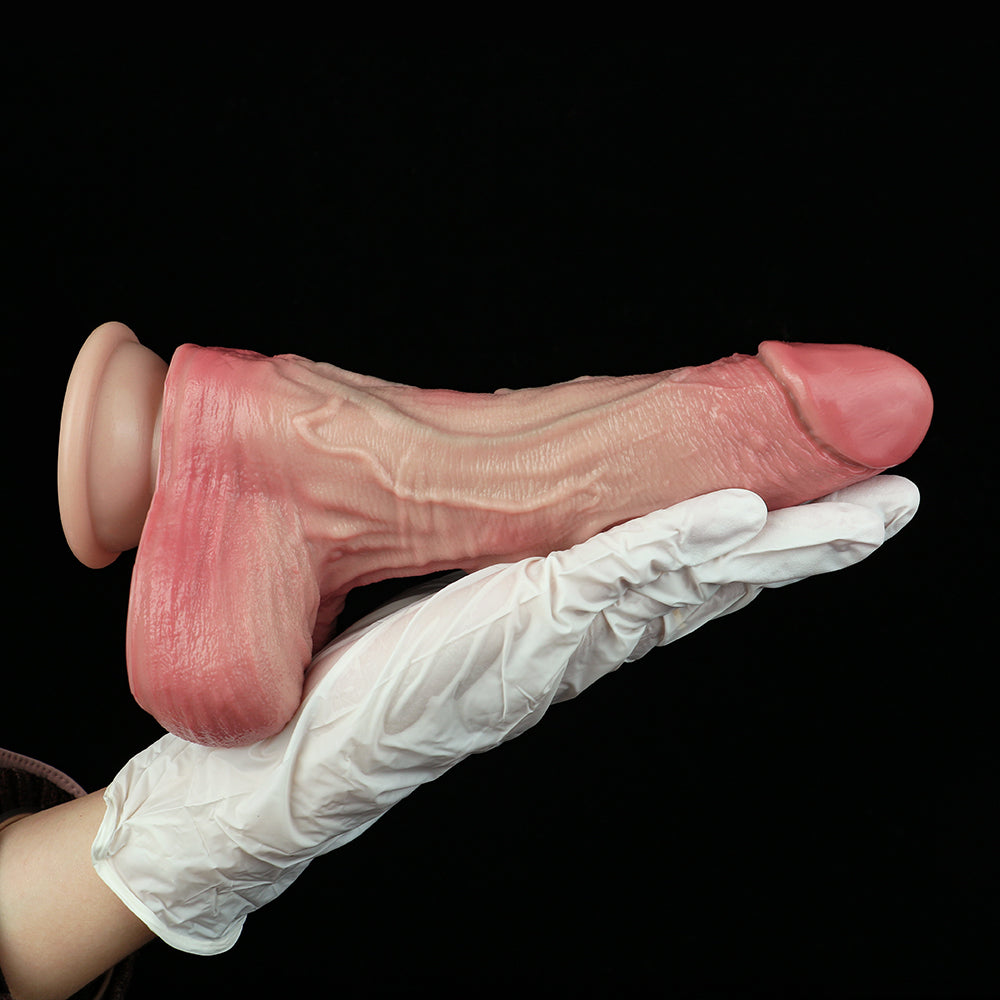 Pink realistic dildo with veining and rounded base, held by white glove.