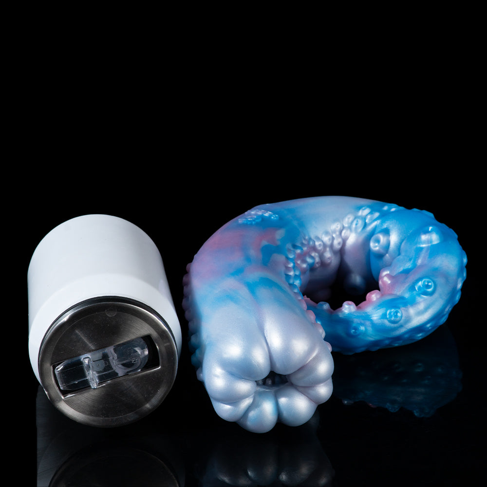 Curved blue-and-pink pleasure device next to a white cylindrical battery holder