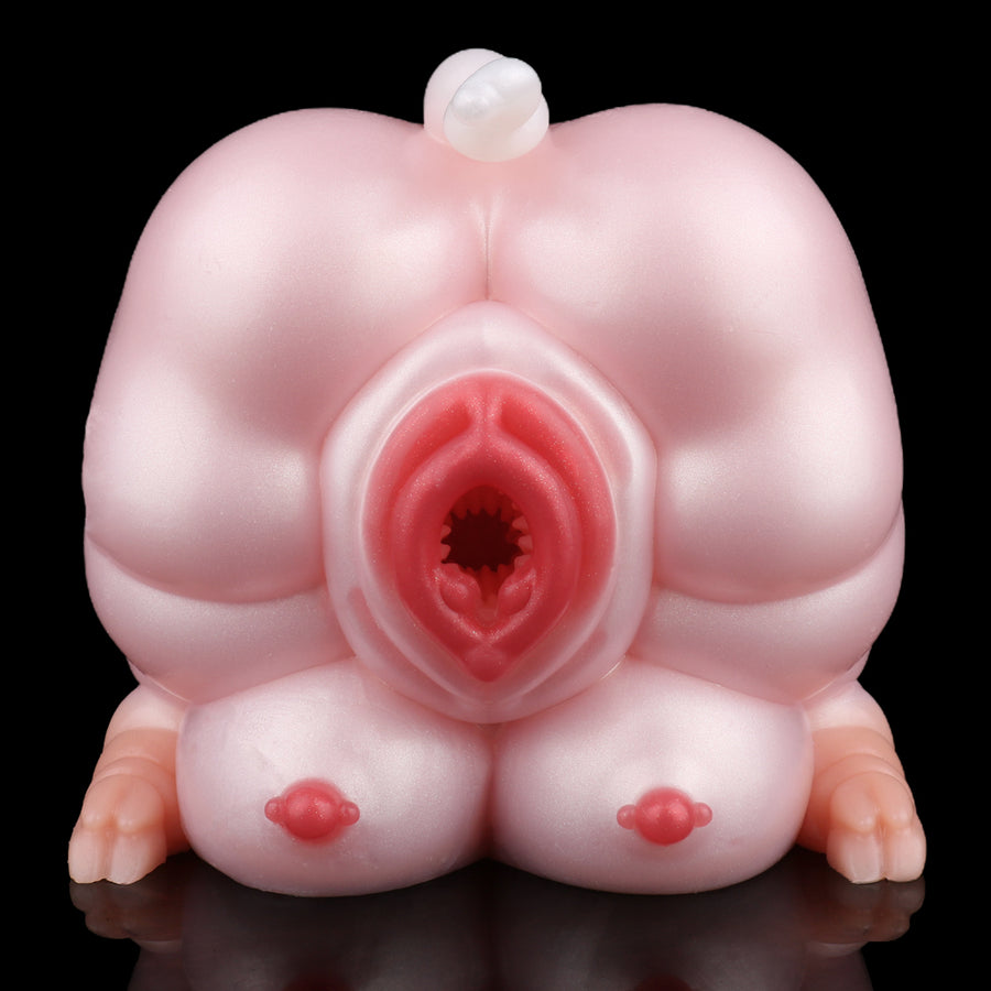 Pink pig sex toy with central red opening and small red heart-shaped details