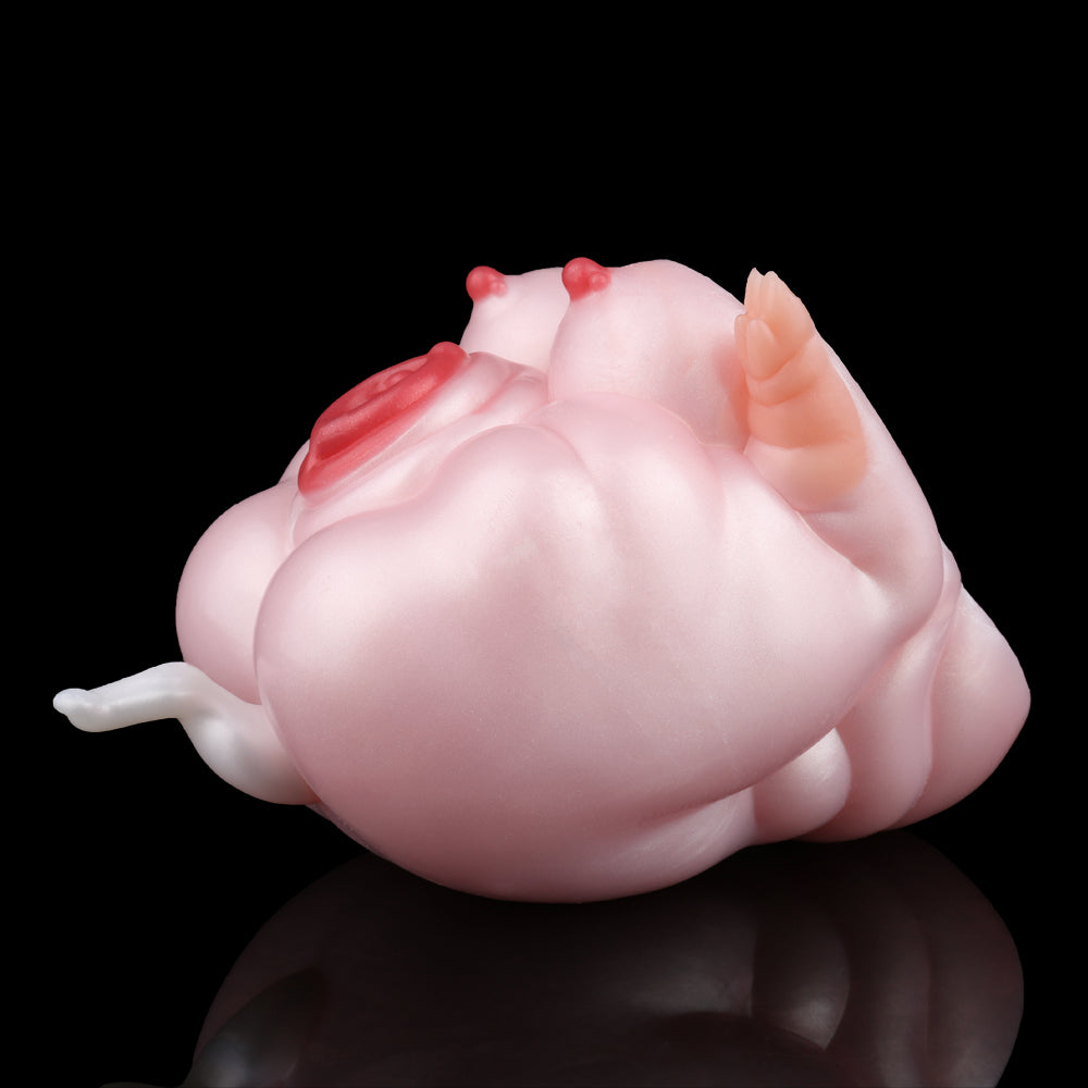 Pink pig-shaped fleshlight, angled view with red top accents and molded body