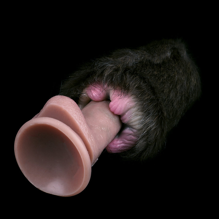Furry cat-themed sex toy with pink-toned insert partially pulled from dark plush