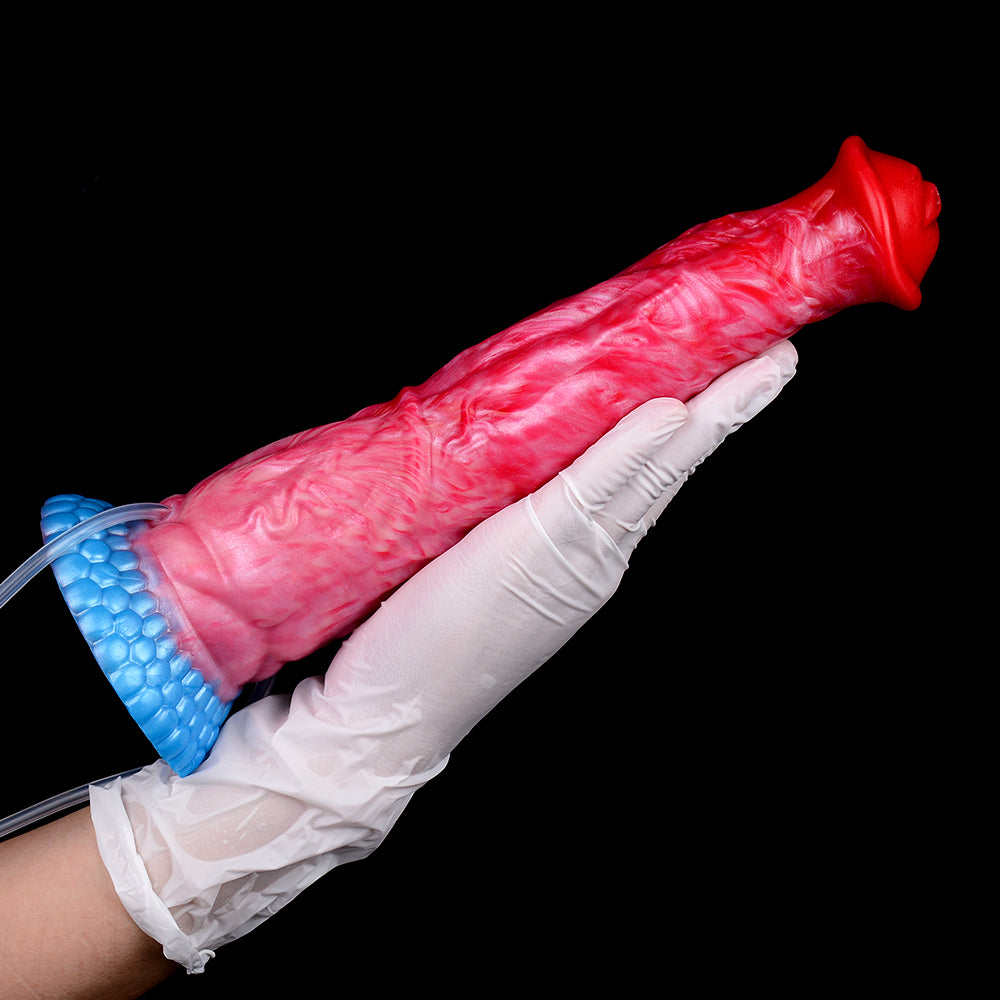 Red/pink dildo lying sideways, blue textured base, clear pump tube