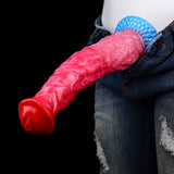 Red/pink dildo inserted into jeans with blue textured pump base visible