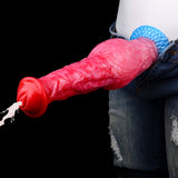 Red/pink dildo inserted, red tip and blue textured base near jeans