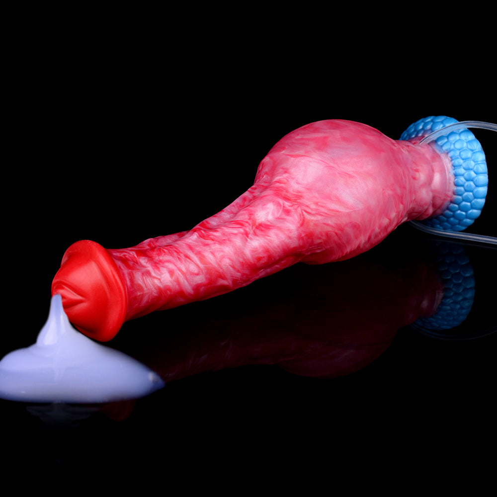 Side view of red/pink dildo with blue textured base and clear tube