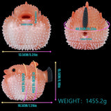 Pink pufferfish stroker shown in front and back views with spiky surface