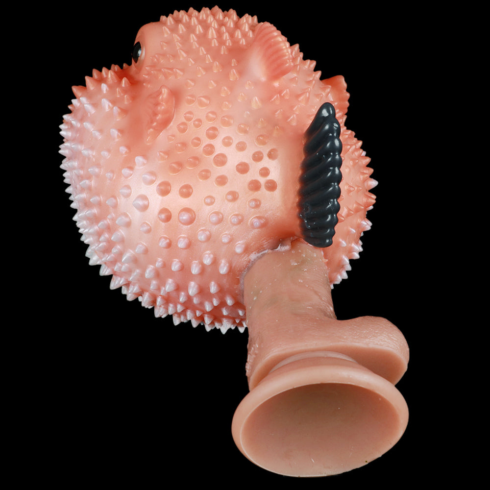 Pink pufferfish sex toy with textured spikes and open mouth