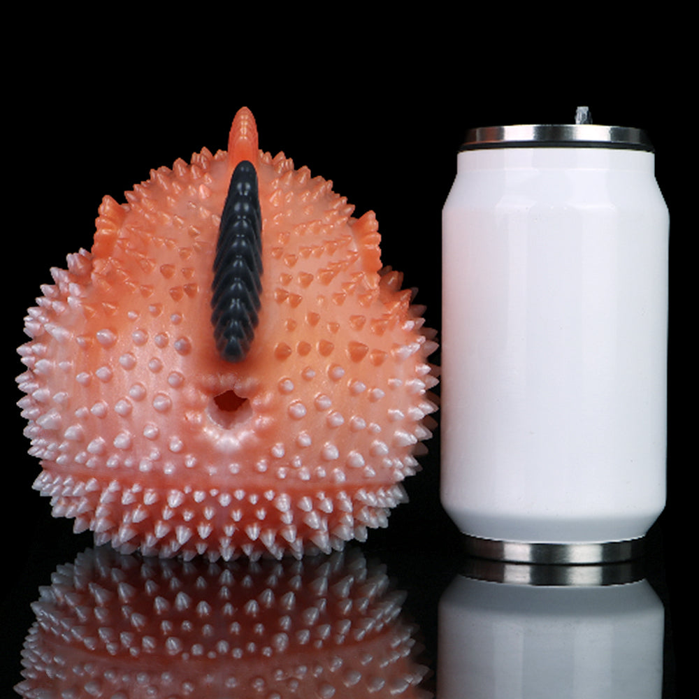 Pink pufferfish stroker with dark dorsal ridge and spiky surface