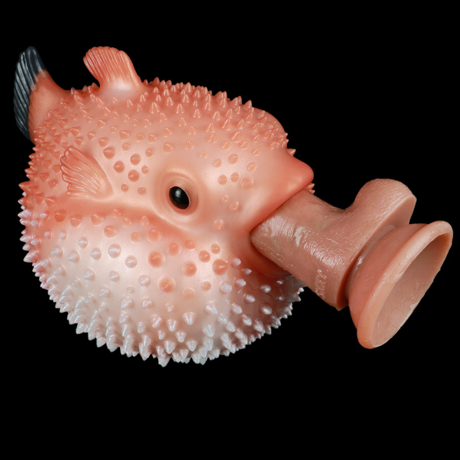 Fish-shaped sex toy with spiky bumpy texture and flared handle end, pink-orange