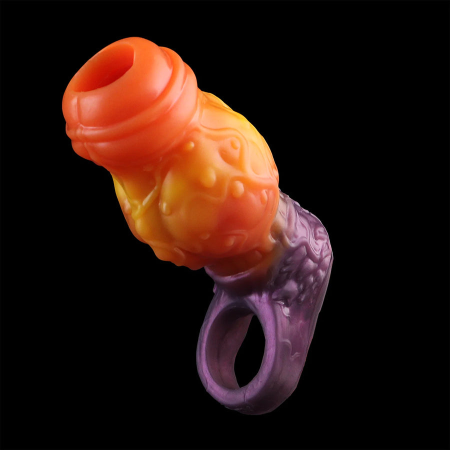 Fantasy knot cock ring with ball ring, angled view showing purple opening and orange knot.