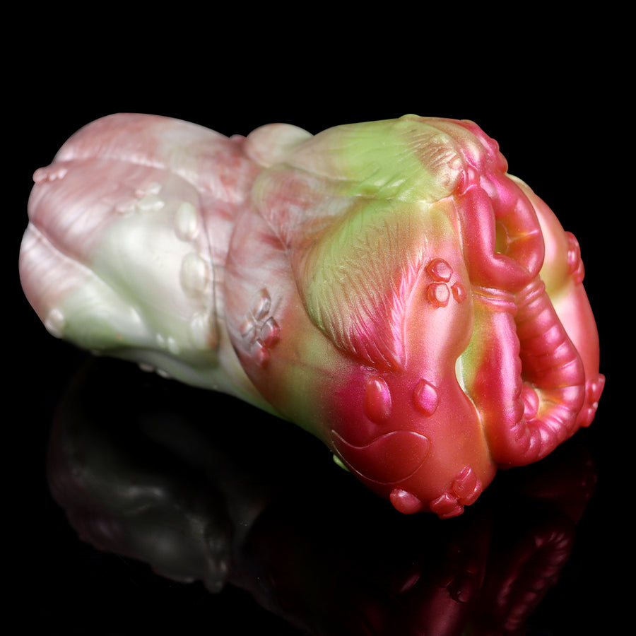 Unicorn-shaped masturbator, angled view of body with embossed details, pink and pale green