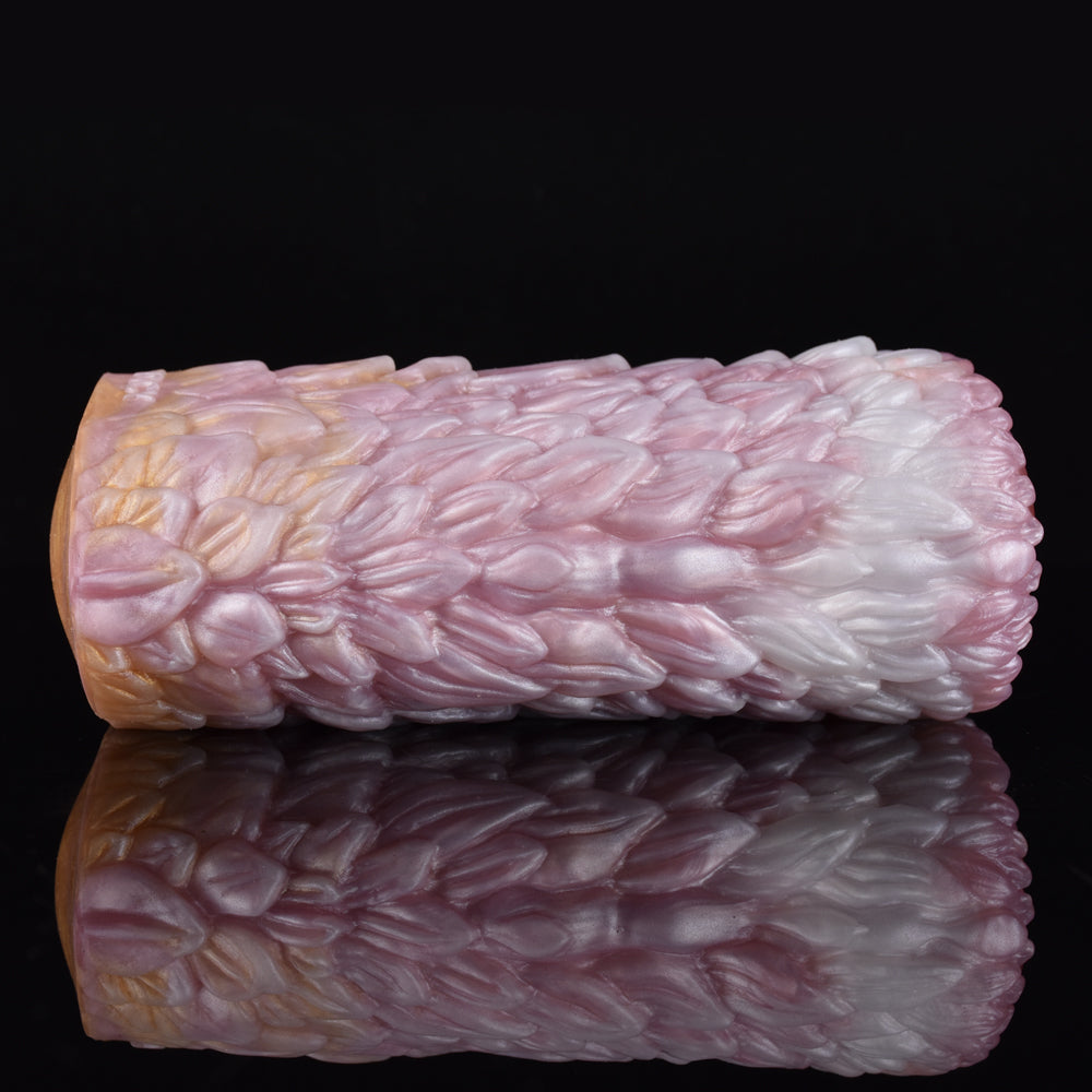 Canine fleshlight stroker with pink-and-cream outer texture and rounded end.