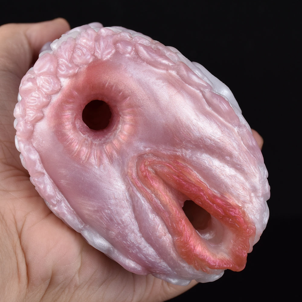 Pink canine fleshlight stroker end cap with oval opening and inner slit detail.