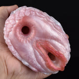 Pink canine fleshlight stroker end cap with oval opening and inner slit detail.