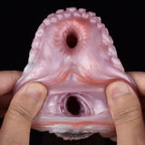 Front view of pink canine fleshlight end with two openings and inner molded channel.