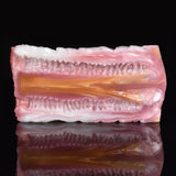 Canine fleshlight stroker with crosswise ribbing and pale pink with warm beige accents.
