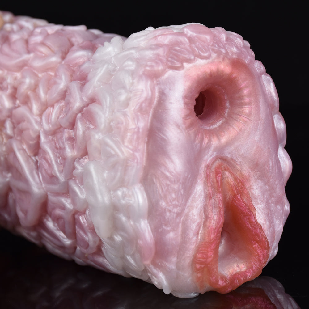Close-up of pink canine fleshlight end opening with inner ridged channel.