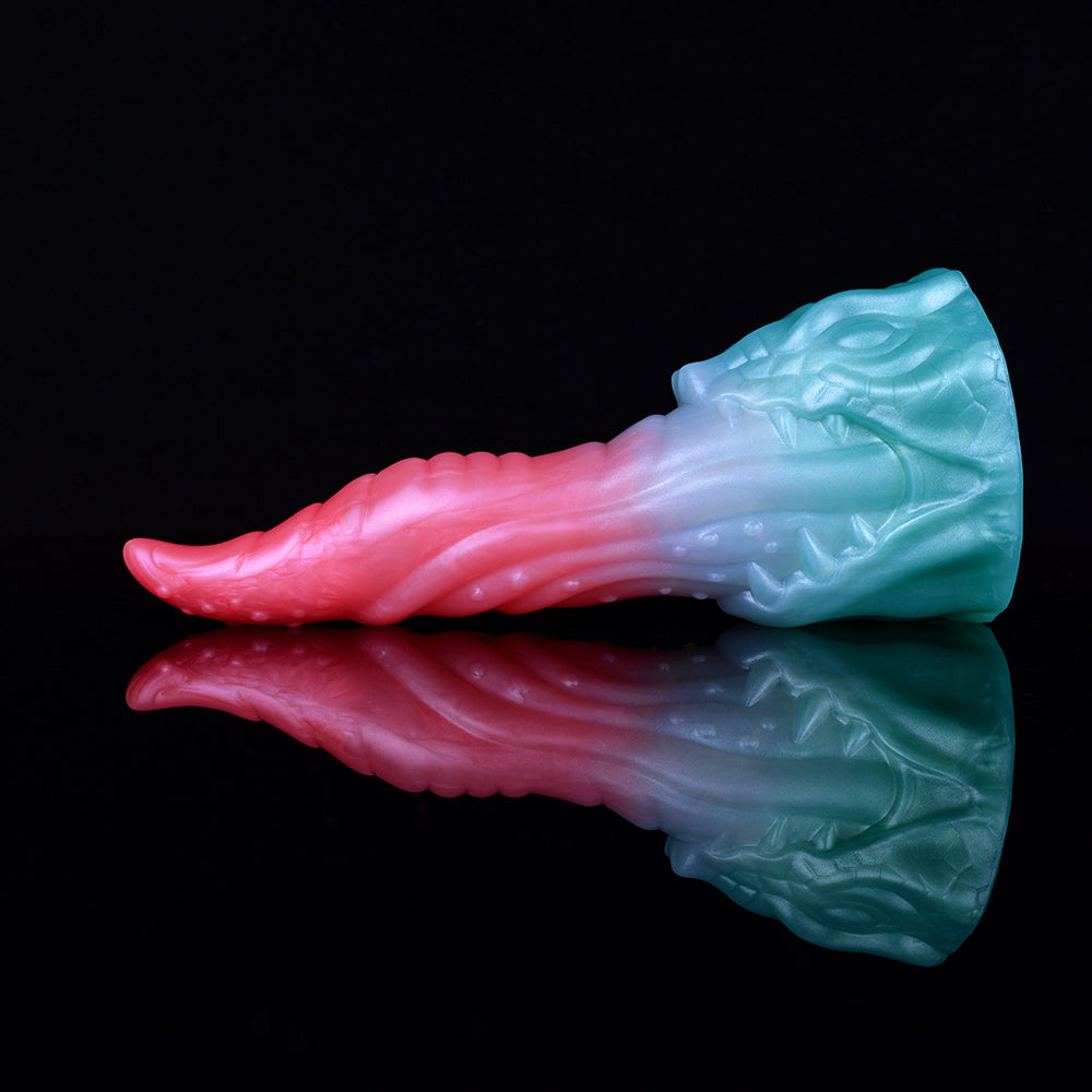 Pink and light-blue dragon-style dildo, reflective finish with textured dragon base.