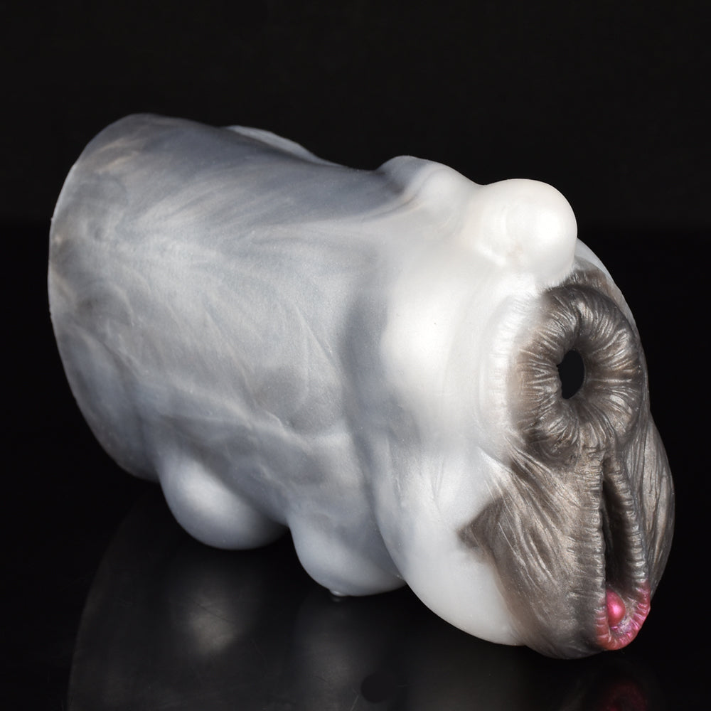 Cow-shaped furry masturbator, close side view with dark fur muzzle and pink tip