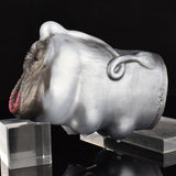 Angus cow-shaped furry sex toy on support, side profile with ear and tail-ring