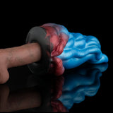 Alien tongue masturbator head with gray suction opening and red-blue ridges, close-up