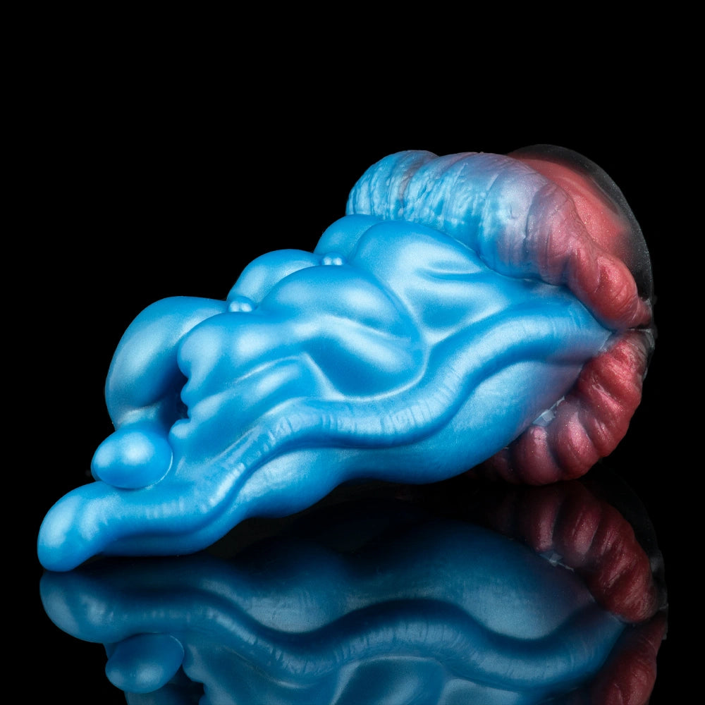 Blue alien tongue masturbator with detailed ridges and red mouth opening, side angle
