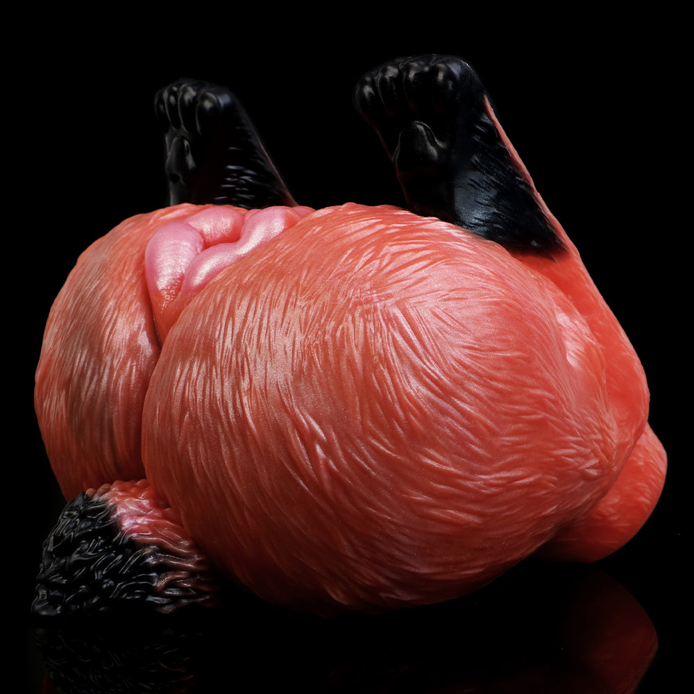 Red animal-themed insert with black accessory pieces, 3D textured surface, close-up