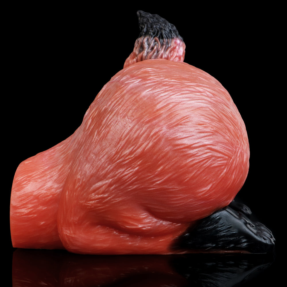 Red animal-themed sex toy insert angled rear view, textured surface, black base