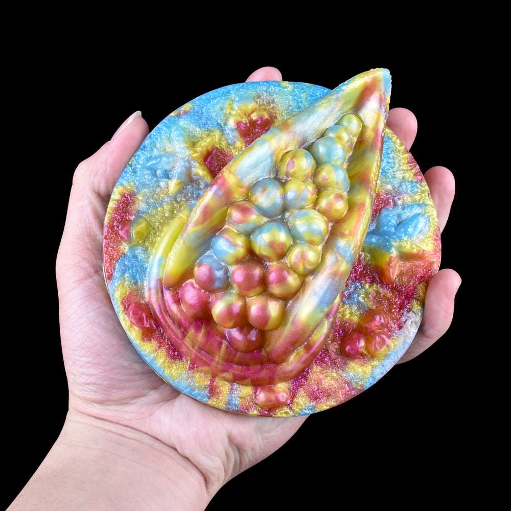 Rhea Fantasy Grinder toy—handheld glitter octopus-themed grinder with raised beads