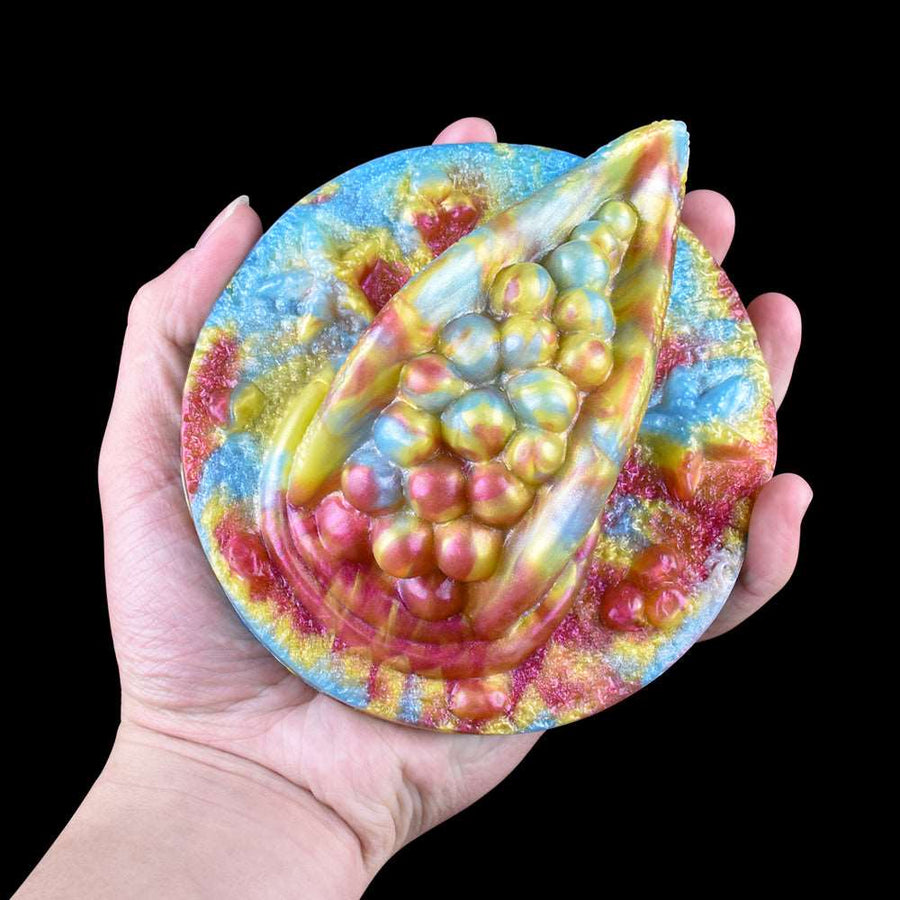 Handheld octopus humping toy grinder with rainbow texture, front view