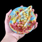 Rhea Fantasy Grinder toy—handheld glitter octopus-themed grinder with raised beads