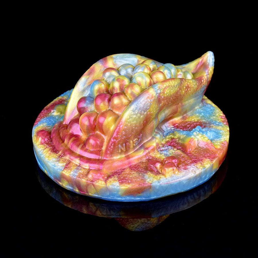 Octopus humping toy grinder with raised bubble-like detailing, angled view