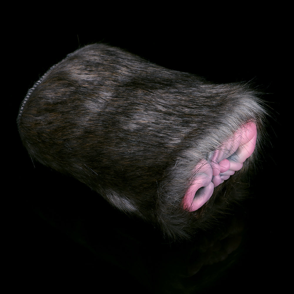 Rhinoceros plush sex toy with gray furry exterior and pink inner sleeve