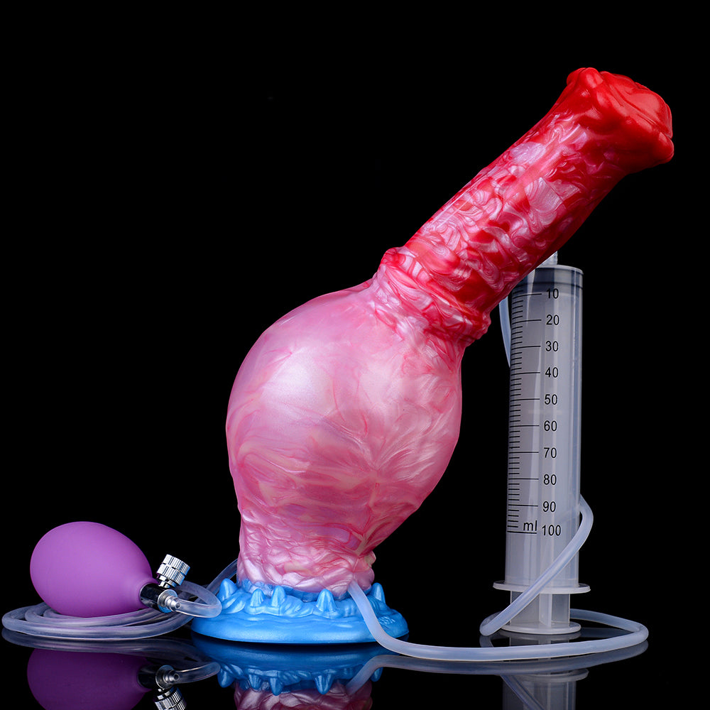 Inflatable dildo next to measuring cylinder, red-to-pink swirled body and blue base