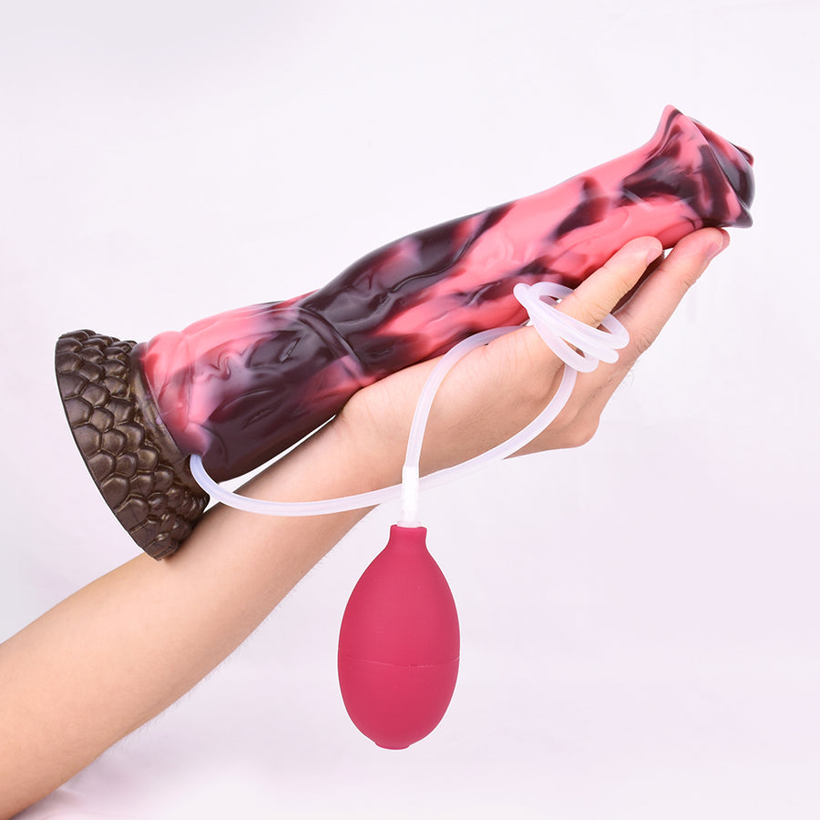 Marbled horse dildo with textured base, white lanyard, and red bulb on a hand