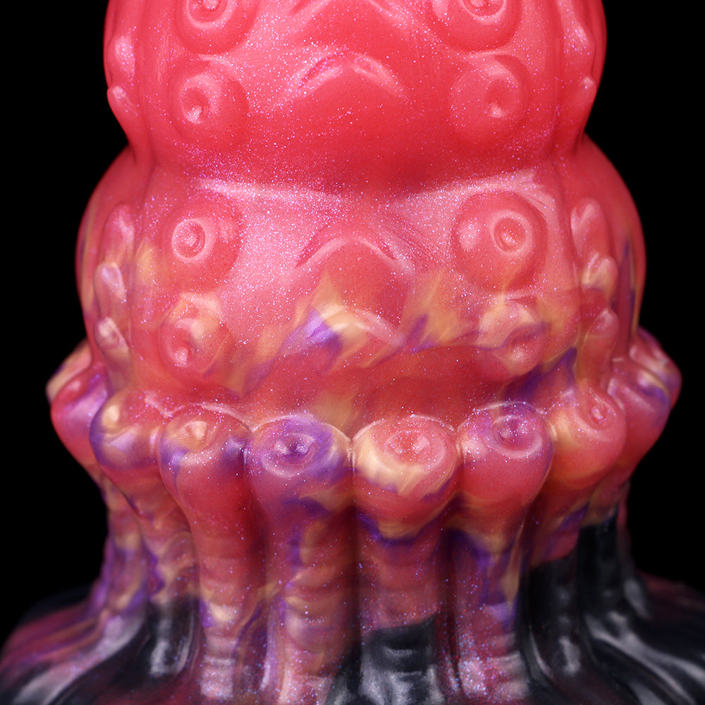 Head close-up: glossy pink alien texture with circular bumps and marbled purple ridges